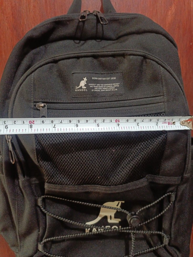 Black Kangol Backpack (Category: Backpacks) located in San Jose del Monte. Submitted by m_nshop (Listing ID 1440656432, Image 3). Description: - needs cleaning and washing Durable black Kangol backpack - Made with tough Cordura fabric - Multiple pockets and compartments for organization - Convenient mesh front pocket - Stylish bungee cord detail - Padded straps and back for maximum comfort - Ideal for everyday use or travel adveCOURIERneeds NO CO