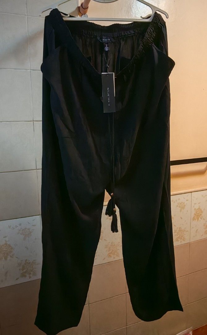Black Wide Leg Pants with Drawstring Waist (Category: Other Bottoms) located in Cavite. Submitted by MLstore (Listing ID 1440615786, Image 2). Description: - Black wide leg pants - Comfortable and flowy material - Elastic waistband with drawstring (tassels included!) - Back pockets - Ideal for casual wear -Garter waist could fit Large BUT best fit for XL asian size depends on waistline WAIST - 34in LENGTH - 40in.