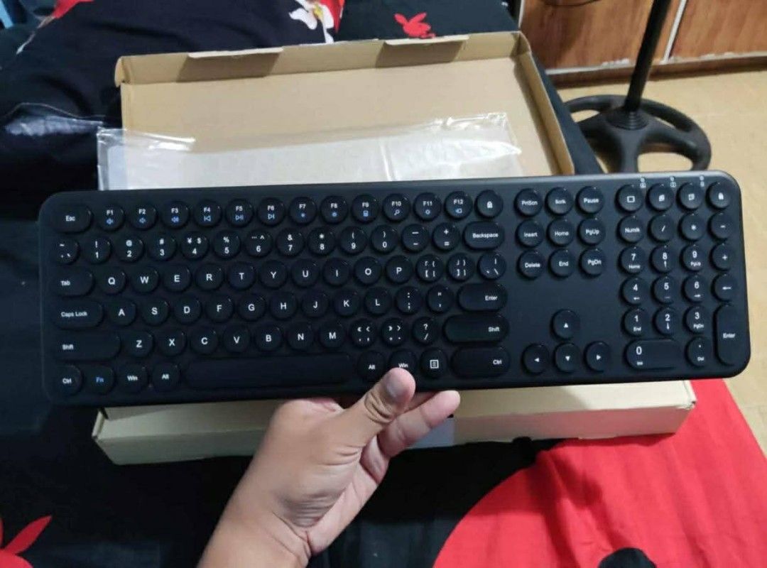 Black Wireless Keyboard with Round Keys (Category: Computer Keyboard) located in Manila. Submitted by negrosyantengmalupet (Listing ID 1440624931, Image 1). Description: - Sleek black wireless keyboard - Unique round keycaps - Compact and space-saving design - Perfect for everyday typing tasks - Fully functional and in great working condition - Comes with its original packaging - Ready to find its new owner! Wireless via dongle AAA battery powere