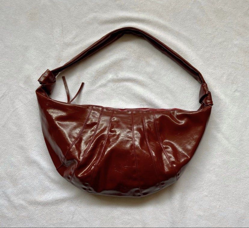Boho/dumpling bag (Category: Shoulder Bags) located in Makati City. Submitted by ullox (Listing ID 1440683228, Image 1). Description: blood red PU leather shoulder bag. Slouchy crescent shape with knotted strap and zipper closure. Perfect for daily use. LasPiñas loc Gcash mop.