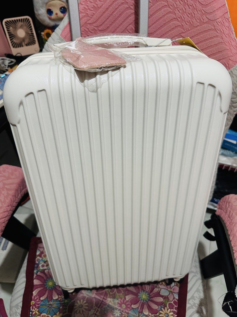 Brand New 22-Inch Luggage with Removable Wheels + FREE Luggage Tag (Category: Luggage) located in Rodriguez. Submitted by cgszone (Listing ID 1440709754, Image 1). Description: Brand New 22-Inch Luggage with Removable Wheels + FREE Luggage Tag ₱1.3K only‼️ FIXED PRICE! Wholesale price na yan! Color White - Compact and lightweight - Removable wheels - Wheels: Smooth 360-degree spinner wheels for effortless movement. - Double zipper anti theft - AB