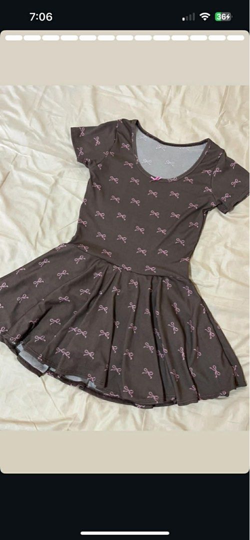 Brown Skort Dress with Pink Bows (Category: Dresses) located in Santa Cruz. Submitted by arasthrift (Listing ID 1440647123, Image 1). Description: - brndnew Adorable brown dress with a charming pink bow pattern. - Skort style with built-in shorts for extra comfort and coverage. - Made from stretchy material for a flexible and comfortable fit. - Fits small to medium sizes (S-M). - Ideal for everyday casual wear..