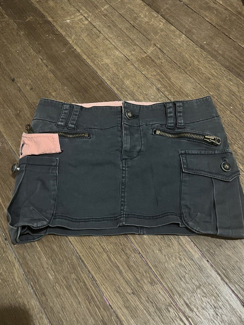 Cargo Micro Skirt (Category: Skirts) located in Taguig. Submitted by yvezntually (Listing ID 1440742935, Image 1). Description: - Cute dark grey cargo mini skirt - Pink lining - Multiple pockets and zippers for a cool, edgy look - Perfect for casual wear - Comfortable fit - Ready for a new home!.
