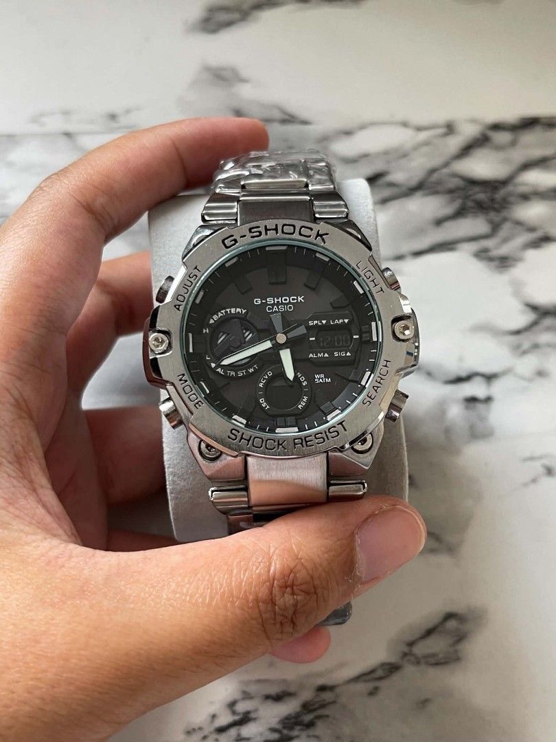 Casio G-Shock Steel Watch MOD (Category: Men's Watches) located in Pasig City. Submitted by gheo0025 (Listing ID 1440724870, Image 2). Description: -modified quality -Shock watch - Durable stainless steel band and bezel - Stylish black dial with both analog and digital displays - Shock resistant for tough conditions - Ideal for everyday wear and sports activities - Feel free to ask any questions! with tin can and paper bag.