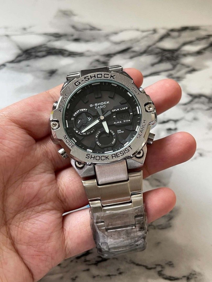 Casio G-Shock Steel Watch MOD (Category: Men's Watches) located in Pasig City. Submitted by gheo0025 (Listing ID 1440724870, Image 1). Description: -modified quality -Shock watch - Durable stainless steel band and bezel - Stylish black dial with both analog and digital displays - Shock resistant for tough conditions - Ideal for everyday wear and sports activities - Feel free to ask any questions! with tin can and paper bag.