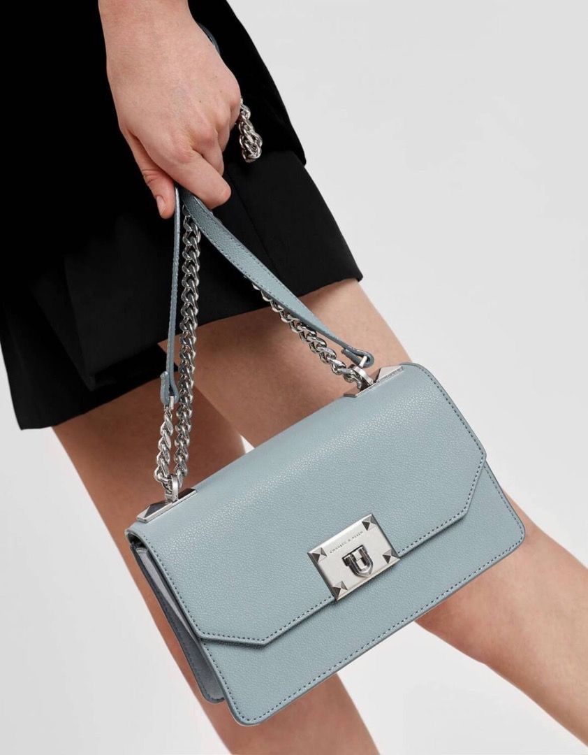 Charles & Keith Light Blue Textured Chain Shoulder Bag (Category: Cross-body Bags) located in Manila. Submitted by mitch_declutterzzz0713 (Listing ID 1440726472, Image 1). Description: - Original price is around 5k - Original Charles and Keith!! - Please check photos for flaws - Light blue textured crossbody bag - Brand: Charles & Keith - Silver chain strap and hardware - Main compartment with interior zip pocket - Versatile for casual or dressed