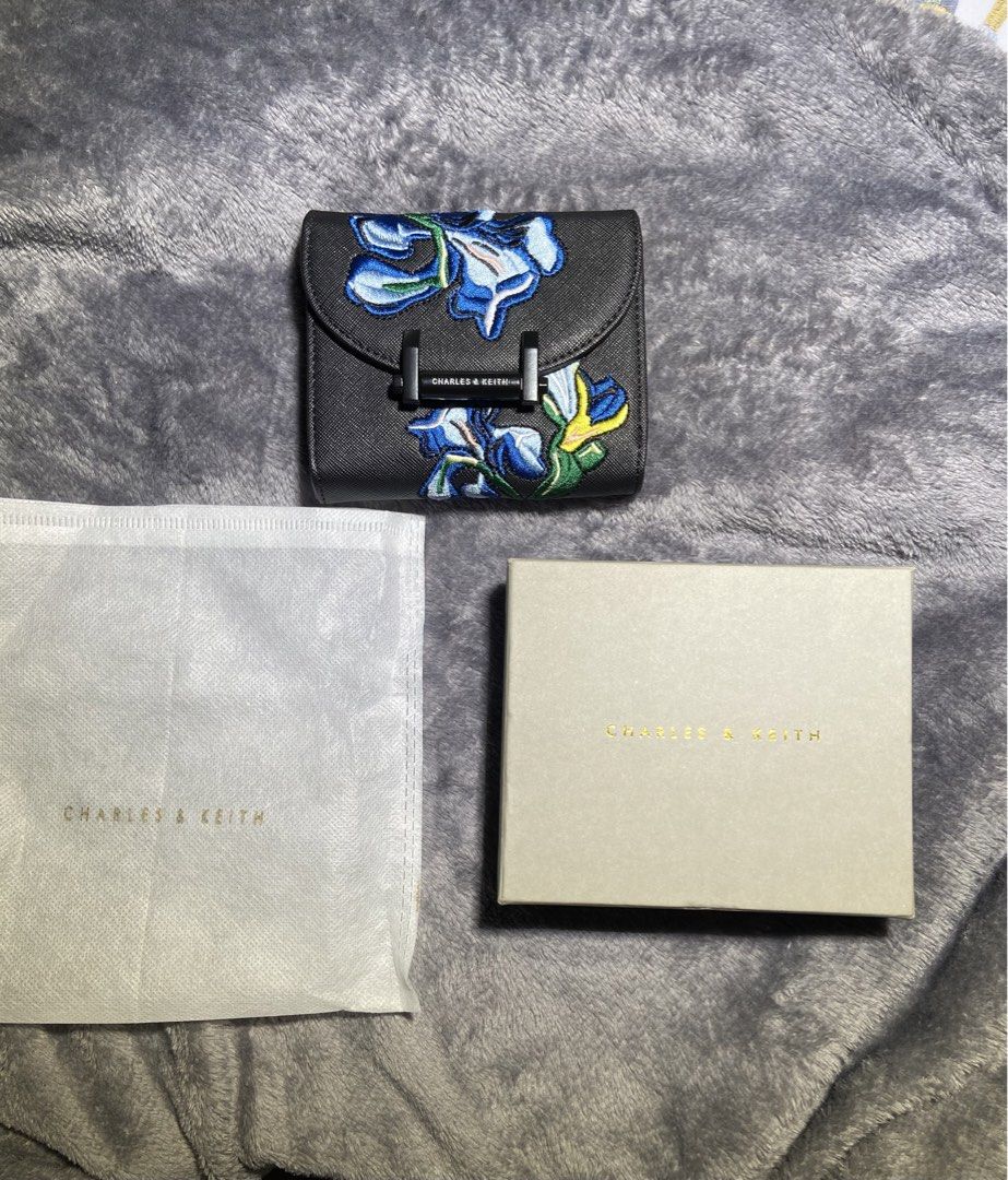 Charles & Keith x Van Gogh Embroidered Wallet (Category: Wallets & Card holders) located in Makati City. Submitted by ullox (Listing ID 1440684189, Image 2). Description: Authentic Charles & Keith wallet, Van Gogh.Black with blue floral embroidery. Tri-fold, has 8 card slots and detachable zip coin purse. Includes dust bag and box. Gcash mop LasPiñas loc.