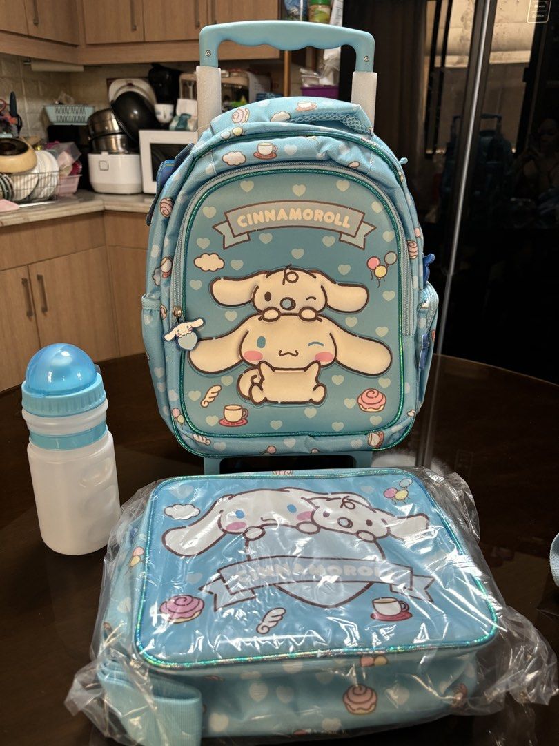 Cinnamoroll Rolling Backpack, Lunch Bag, and Water Bottle Set (Category: Backpacks) located in Pasig City. Submitted by k8s_charm_est.2021 (Listing ID 1440630984, Image 1). Description: - Adorable Cinnamoroll rolling backpack set - Includes matching insulated lunch bag - Comes with a water bottle - Backpack features wheels and a retractable handle for easy transport - Insulated lunch bag keeps food fresh - Ideal for school or travel adventures - 