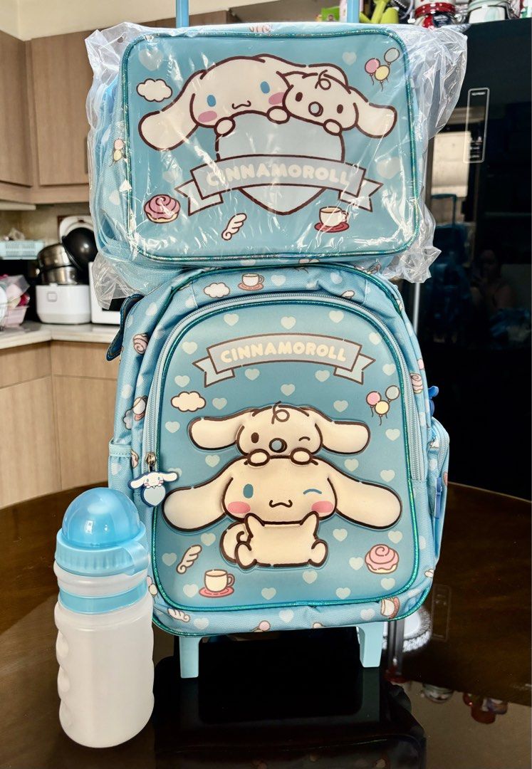 Cinnamoroll Rolling Backpack, Lunch Bag, and Water Bottle Set (Category: Backpacks) located in Pasig City. Submitted by k8s_charm_est.2021 (Listing ID 1440630984, Image 3). Description: - Adorable Cinnamoroll rolling backpack set - Includes matching insulated lunch bag - Comes with a water bottle - Backpack features wheels and a retractable handle for easy transport - Insulated lunch bag keeps food fresh - Ideal for school or travel adventures - 