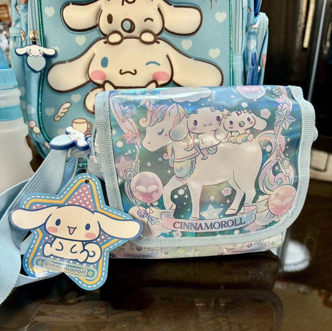 Cinnamoroll Rolling Backpack, Lunch Bag, and Water Bottle Set (Category: Backpacks) located in Pasig City. Submitted by k8s_charm_est.2021 (Listing ID 1440630984, Image 2). Description: - Adorable Cinnamoroll rolling backpack set - Includes matching insulated lunch bag - Comes with a water bottle - Backpack features wheels and a retractable handle for easy transport - Insulated lunch bag keeps food fresh - Ideal for school or travel adventures - 