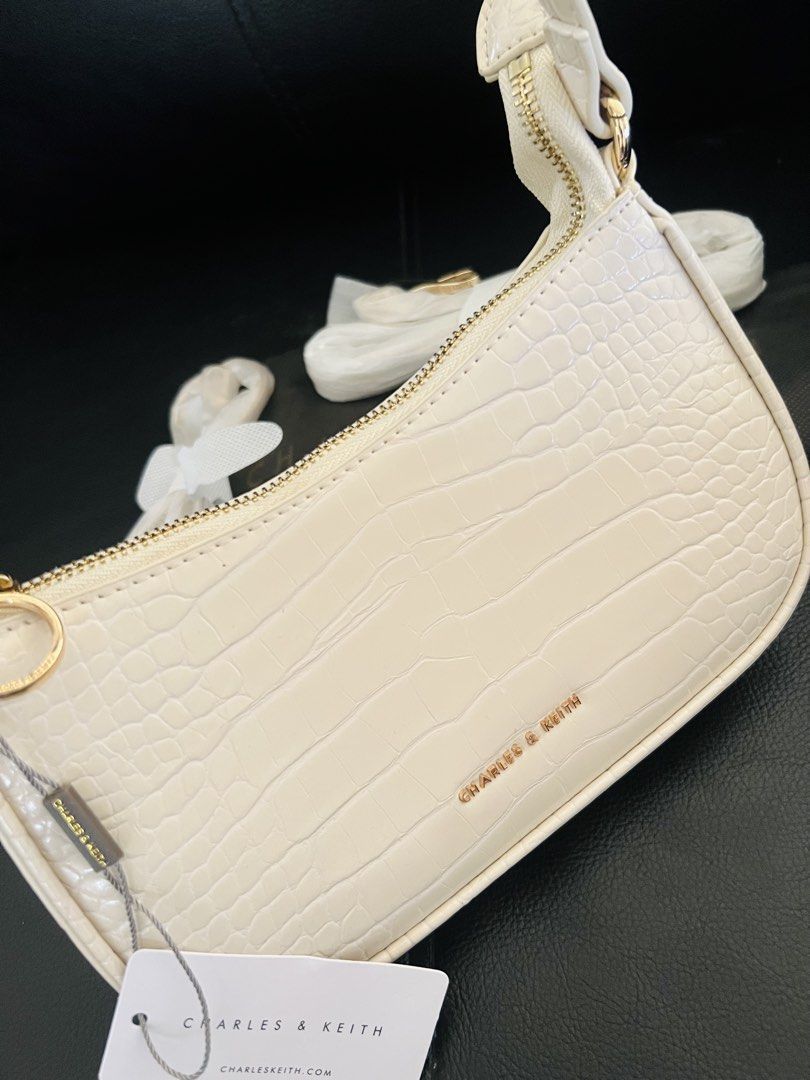 C&K bag for women (Category: Shoulder Bags) located in Lingayen. Submitted by jjsid (Listing ID 1440644369, Image 2). Description: ‼️Pls Read‼️ ✨MPO Quality✨ Charles & Keith Elspeth Croc-Effect Chain-Link Shoulder Bag >>Brand New >>White, with 2 extra straps >>comes with tag & ecobag >>dimensions:(width: 22cm depth:5cm height:12cm) 📌actual photos posted; last 3 photos for your reference only ✨Price indicated is slightly negotiable ❌no to low bal
