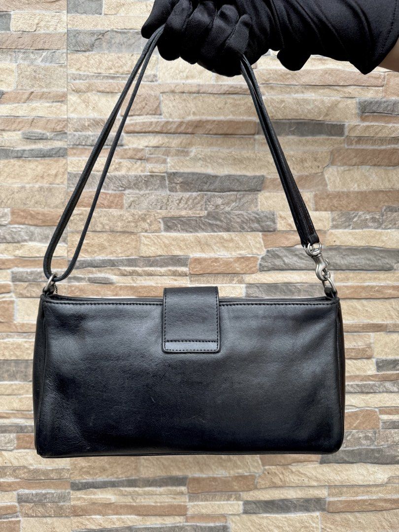 Coach Demi Baguette (9818) (Category: Luxury Bags & Wallets) located in Cavite. Submitted by justbrowsing_decluttering (Listing ID 1440661271, Image 3). Description: Cross-body | Shoulder Bag 1 Zip pocket inside Color: Blue-Black with Silver Tone Hardware Size: Medium Material: Genuine Glove Tan Leather [Colors may vary due to lighting. Bags are Preowned so it will Not be Perfect; Unless stated new.] Unknown glare in the leather (as you can see i