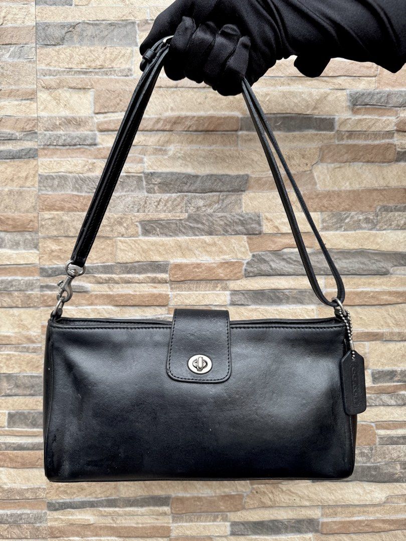 Coach Demi Baguette (9818) (Category: Luxury Bags & Wallets) located in Cavite. Submitted by justbrowsing_decluttering (Listing ID 1440661271, Image 1). Description: Cross-body | Shoulder Bag 1 Zip pocket inside Color: Blue-Black with Silver Tone Hardware Size: Medium Material: Genuine Glove Tan Leather [Colors may vary due to lighting. Bags are Preowned so it will Not be Perfect; Unless stated new.] Unknown glare in the leather (as you can see i