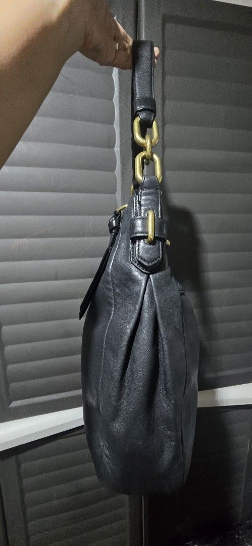 Coach Leather Shoulder Bag with Gold Hardware (Category: Luxury Bags & Wallets) located in Manila. Submitted by muliph (Listing ID 1440674720, Image 3). Description: - Genuine black leather shoulder bag - Elegant gold hardware details - Secure zip closure - Adjustable strap with buckles for a custom fit - Ample interior space for your essentials - Ideal for everyday wear.
