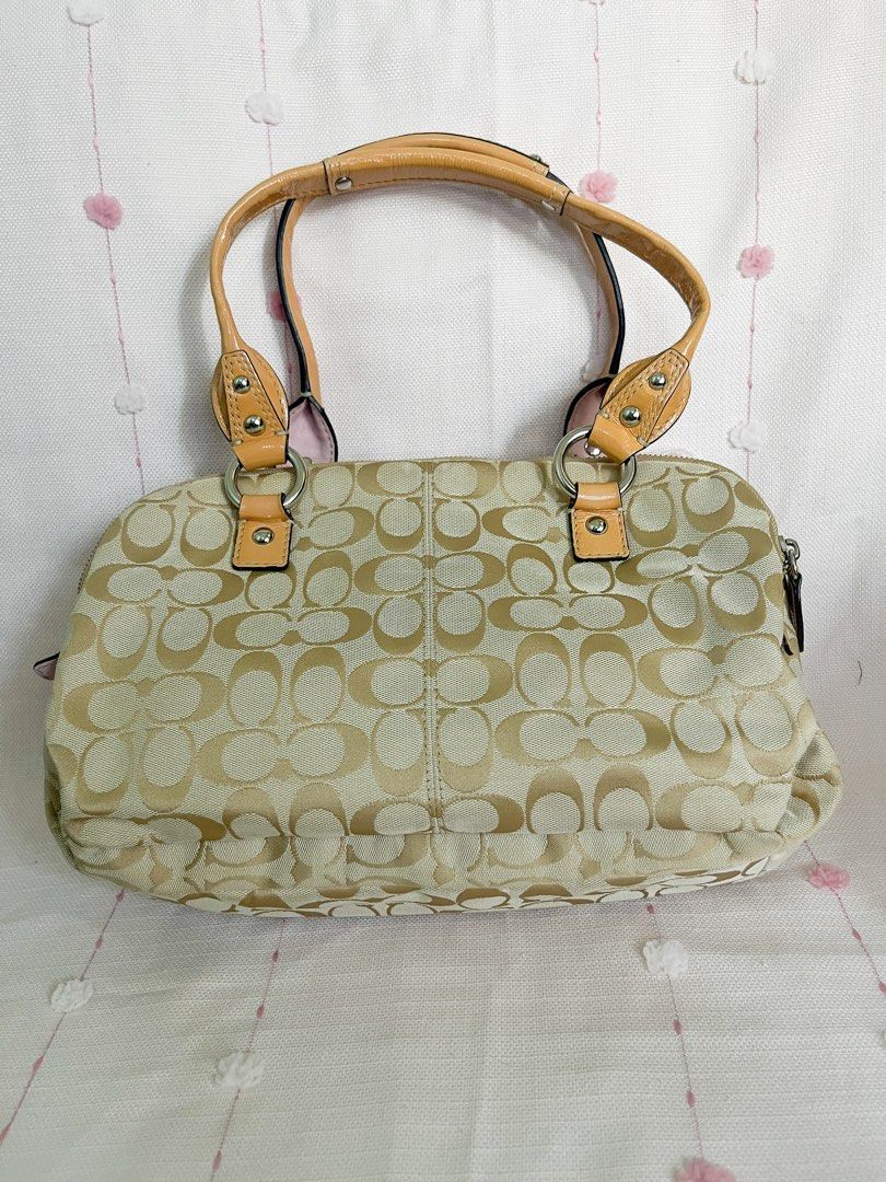Coach PENELOPE Canvas FREE SF (Category: Luxury Bags & Wallets) located in Manila. Submitted by dj_mj (Listing ID 1440616935, Image 3). Description: - Authentic Coach monogram canvas handbag - Signature tan and beige 'C' pattern - Tan leather trim and handles - Light pink satin interior - Interior leather tag with serial number: L1049-F14695 - Secure zipper closure - Comes with a decorative ribbon tied to the handle.