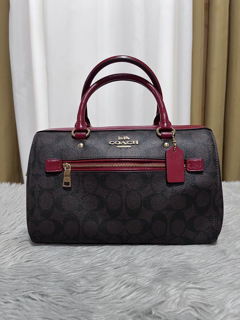 Coach Rowan (Category: Luxury Bags & Wallets) located in Nagcarlan. Submitted by prelovedbymayen (Listing ID 1440603756, Image 1). Description: Coach Rowan Satchel in Signature Canvas, featuring a classic brown monogram coated canvas paired with vibrant red leather trim and handles. ✅💯Authentic ✅Pre-loved from Japan ✅with minimal issue on strap and handle .