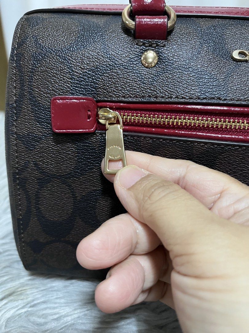 Coach Rowan (Category: Luxury Bags & Wallets) located in Nagcarlan. Submitted by prelovedbymayen (Listing ID 1440603756, Image 3). Description: Coach Rowan Satchel in Signature Canvas, featuring a classic brown monogram coated canvas paired with vibrant red leather trim and handles. ✅💯Authentic ✅Pre-loved from Japan ✅with minimal issue on strap and handle .