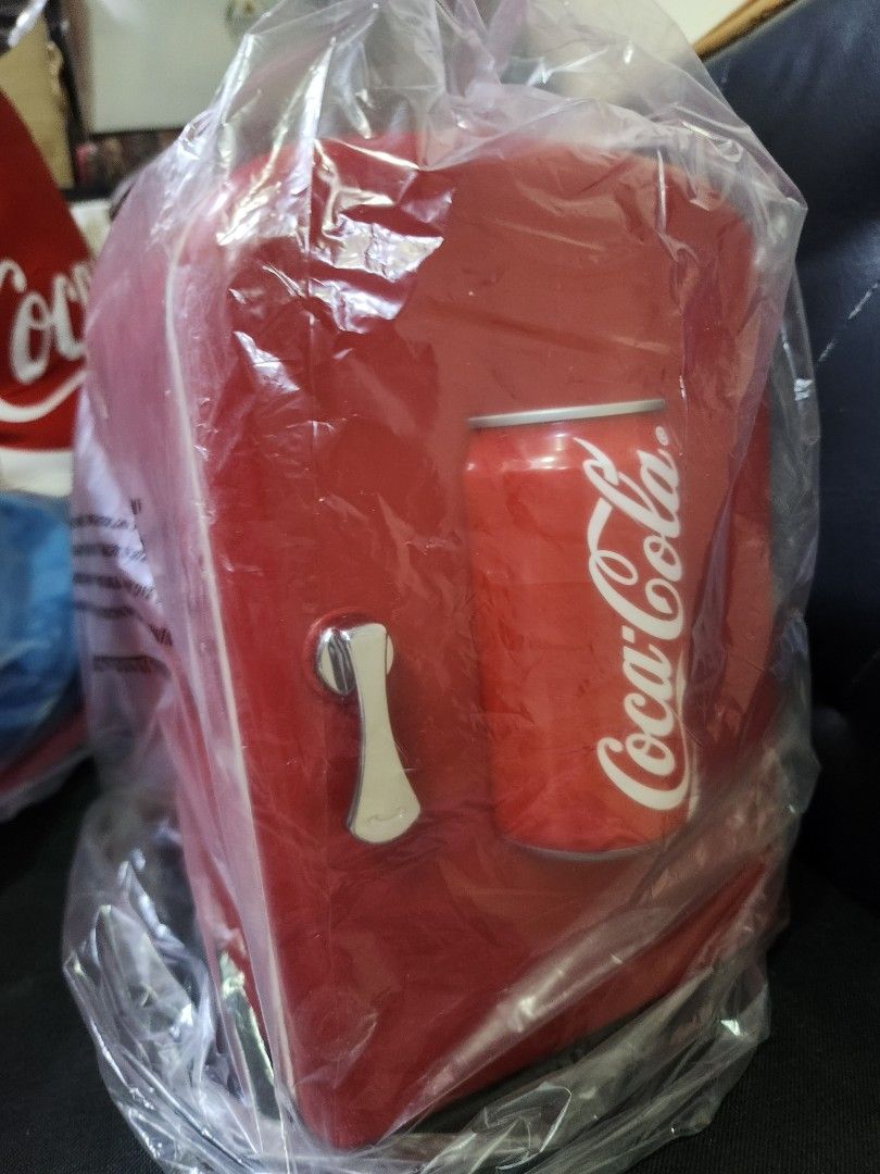 Coca-Cola Thermoelectric Cooler & Warmer mini fridge (Category: Food Organization & Storage) located in Pasig City. Submitted by js.authenticlux (Listing ID 1440705722, Image 3). Description: - Red Coca-Cola thermoelectric cooler and warmer - Ideal for storing drinks and fruits - Perfect for picnics, camping, or office use - Compact and portable design - Keeps items cool or warm on the go - Comes with power adapter and car adapter - call txt 0917