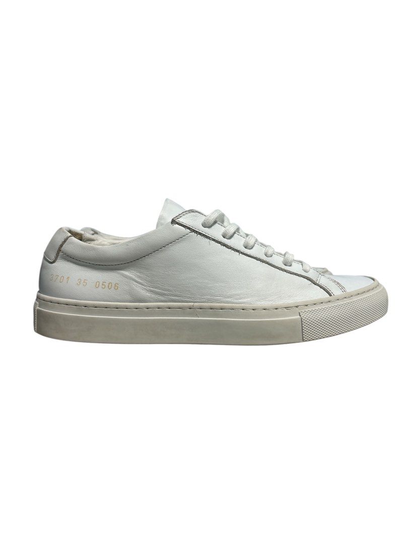Common Projects Original Achilles Low White Leather Sneakers (Category: Sneakers) located in Cagayan de Oro. Submitted by thatsdopethrift (Listing ID 1440706596, Image 1). Description: Authentic Common Projects Original Achilles Low in White Leather. The ultimate luxury minimalist sneaker. This pair features the iconic gold foil serial numbers on the heels, confirming the style, size, and universal white color code. Made in Italy with premium cal