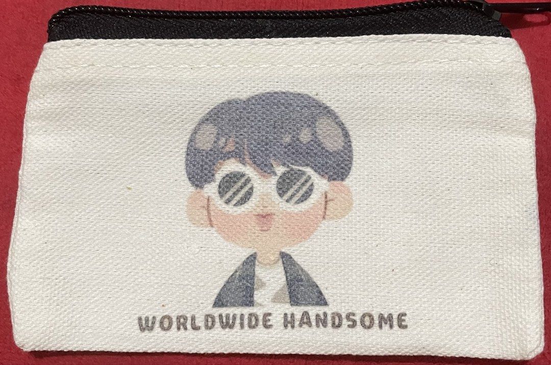 Cute Cartoon Pouch with 'Worldwide Handsome' Text (Category: Purses & Pouches) located in Quezon City. Submitted by stuffsrus (Listing ID 1440596661, Image 1). Description: White canvas pouch with a cute cartoon character print. The text 'WORLDWIDE HANDSOME' is printed at the bottom. Zipper closure at the top. Great for storing small items like coins, cards, or makeup. Compact and portable. Fun design for fans..