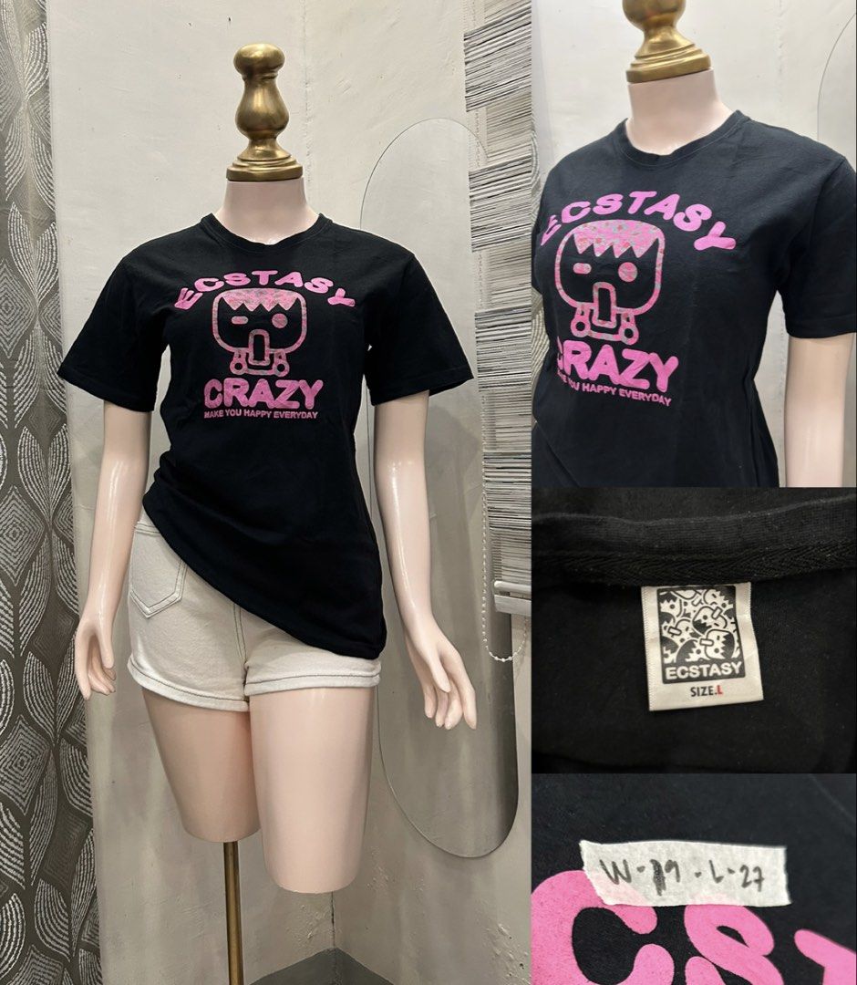 Ecstasy Crazy Black T-shirt Size L (Category: Tshirts & Polo Shirts ) located in Roxas City. Submitted by kaisclstrxs_5801 (Listing ID 1440729140, Image 1). Description: - Black t-shirt - Size L - Features a pink 'Ecstasy Crazy' graphic print - Graphic text: 'Make You Happy Everyday' - Ideal for casual wear.