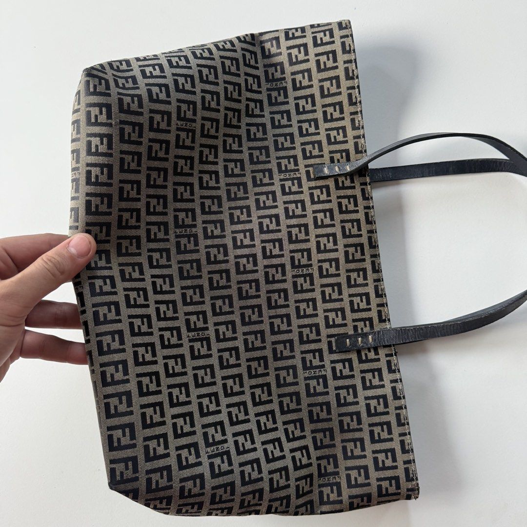 Fendi zucca handbag (Category: Luxury Bags & Wallets) located in Cavite. Submitted by kalebfindsluxs (Listing ID 1440719311, Image 2). Description: Fendi zucca handbag Good Issue sa gilid may punit Check details - 2500 + sf Loc cavite Jnt / lalamove.