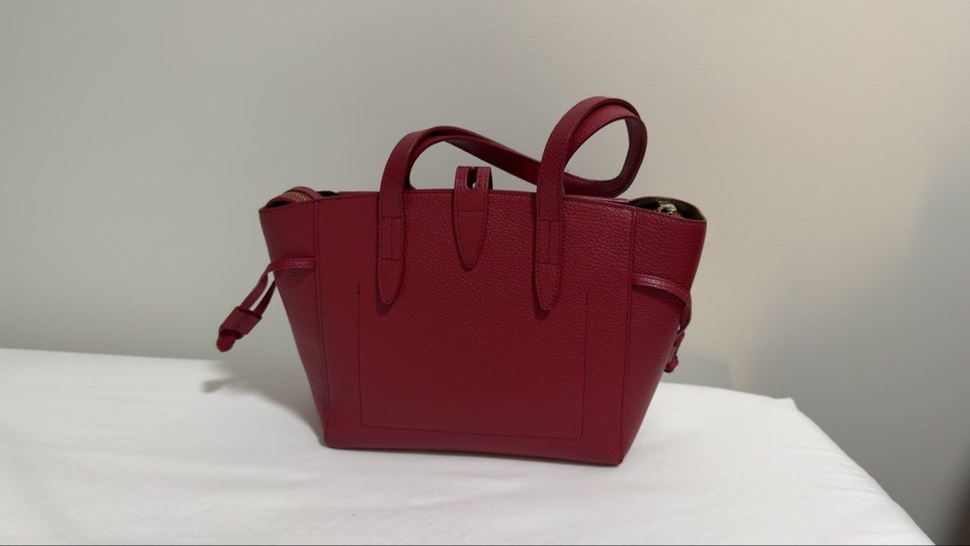 Furla Genuine Leather Shoulder Bag - Red (Category: Luxury Bags & Wallets) located in Paranaque City. Submitted by nia_2ndhand (Listing ID 1440685247, Image 2). Description: COMPLETE WITH DUST BAG AND PRICE TAG - Authentic Furla red pebbled leather tote bag - Made in Bulgaria - Genuine leather - Zip closure - Two top handles - Interior zip pocket - Interior slip pocket - Gold hardware details - Ideal for everyday use.