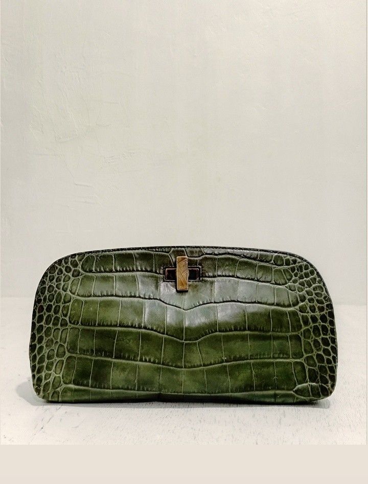 FURLA Green Crocodile Embossed Elegant Clutch (Category: Luxury Bags & Wallets) located in Navotas City. Submitted by ms.soulana (Listing ID 1440599343, Image 1). Description: PreOwned Lightly Used FURLA Croc Embossed leather Elegant green clutch Pouch - Crocodile embossed texture - Secure Silvertone clasp closure - Compact, curved shape - Ideal for evenings and special occasions - Fits phone, cards, and lipstick Sign of Used Min Rubs sa Croc Lea