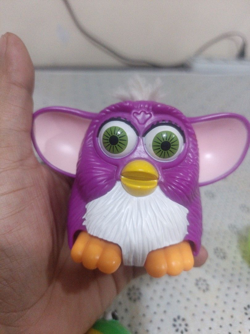 ❗SALE❗Gremilins Purple hard Toy (Category: Designer & Blind Box Toys) located in Marikina City. Submitted by andreah_16 (Listing ID 1440676217, Image 3). Description: - Adorable purple Furby toy - Approximately 3 inches tall - Distinctive features: big green eyes, orange feet, pink inner ears, white fur on top - Fun for both children and toy collectors - A charming addition to any collection.