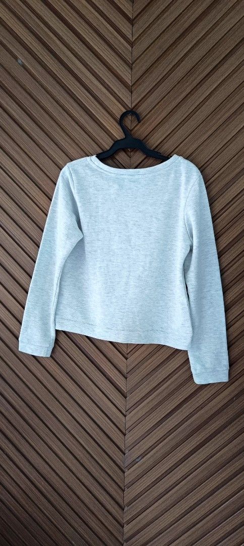 Grey Embellished Long Sleeve Sweater (Category: Longsleeves) located in Davao. Submitted by fabmegashop (Listing ID 1440688065, Image 2). Description: - Light grey sweater - Textured pattern - Small sparkly embellishments all over - Round neckline - Long sleeves - Measurements: Chest approx 18 inches, Sleeve length approx 17 inches - Ideal for a casual look.
