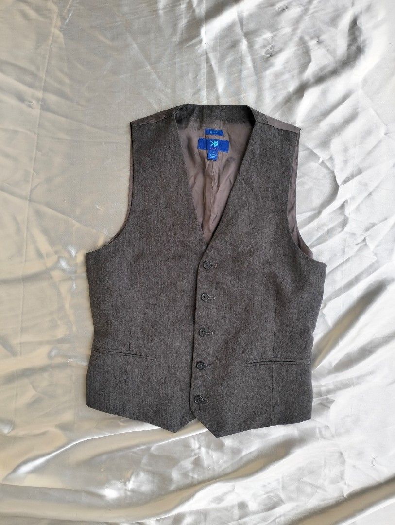 Grey Formal Vest (Category: Vests) located in Manila. Submitted by itscthxneeee (Listing ID 1440645302, Image 1). Description: - Grey formal vest - Button-up front - Classic V-neckline - Smooth inner lining - Suitable for suits or smart outfits - Great for events or work.