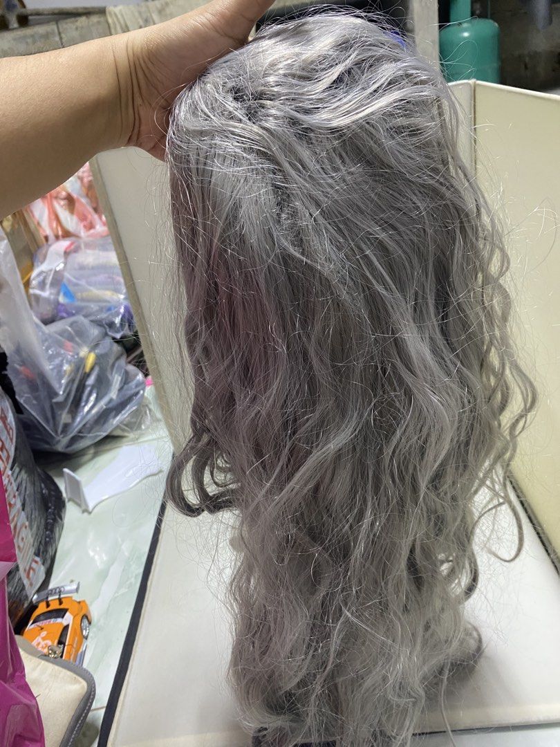 Grey Wavy Long Wig Hairpiece (Category: Hair Accessories) located in Pasacao. Submitted by wengpullar37205 (Listing ID 1440731191, Image 2). Description: - Grey long wavy wig - Synthetic hair appearance - Mesh cap with adjustable straps - Ideal for costumes or everyday wear - Selling because it's no longer needed -free napo ung short hair,super lambot ng Hair nia.