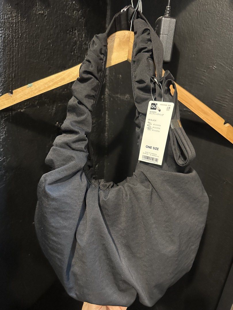 GU Women's Dumpling Bag - Black (Category: Shoulder Bags) located in Taytay. Submitted by j_r_t (Listing ID 1440595254, Image 1). Description: Brand new GU black handle bag with tags. Zip closure, polyester material. Japan sourced, 1000 php plus sf Ships from Angono, Rizal via J&T or Lalamove in nearby areas.