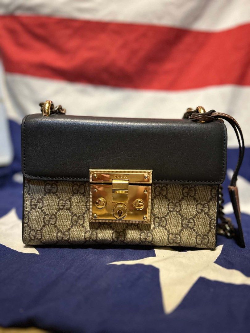 Gucci GG Supreme Padlock Shoulder Bag (Category: Luxury Bags & Wallets) located in Quezon City. Submitted by ozzy04 (Listing ID 1440688137, Image 1). Description: - Classic GG Supreme canvas with black leather trim - Gold-tone hardware - Signature padlock closure - Chain strap for shoulder wear - Interior leather tag with serial number: 409371 2209 - Versatile for everyday use or special occasions.