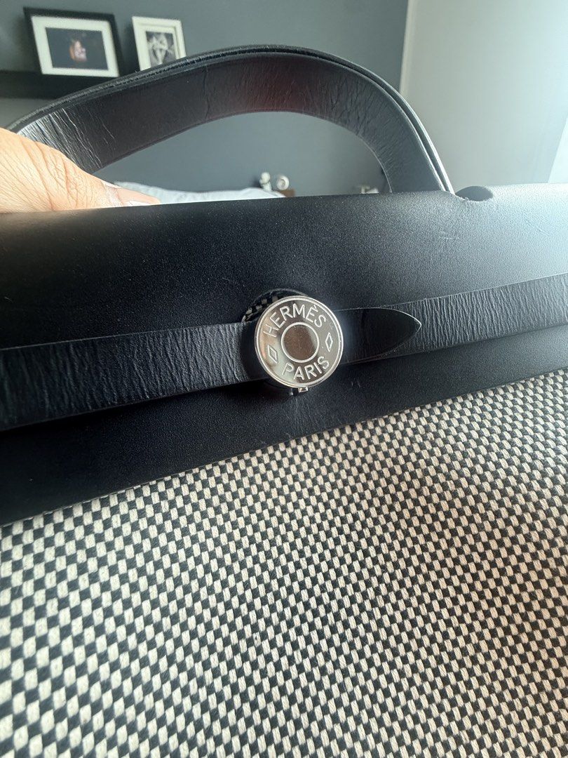 Hermes her bag (Category: Luxury Bags & Wallets) located in Taguig. Submitted by tipssy2 (Listing ID 1440578518, Image 3). Description: - Authentic Hermes Her bag - Black leather top and handles - Canvas body with checkered pattern - Comes with lock and keys - Includes original dust bag - Original orange Hermes box included - lightly used bought in October 2025 in Ireland .