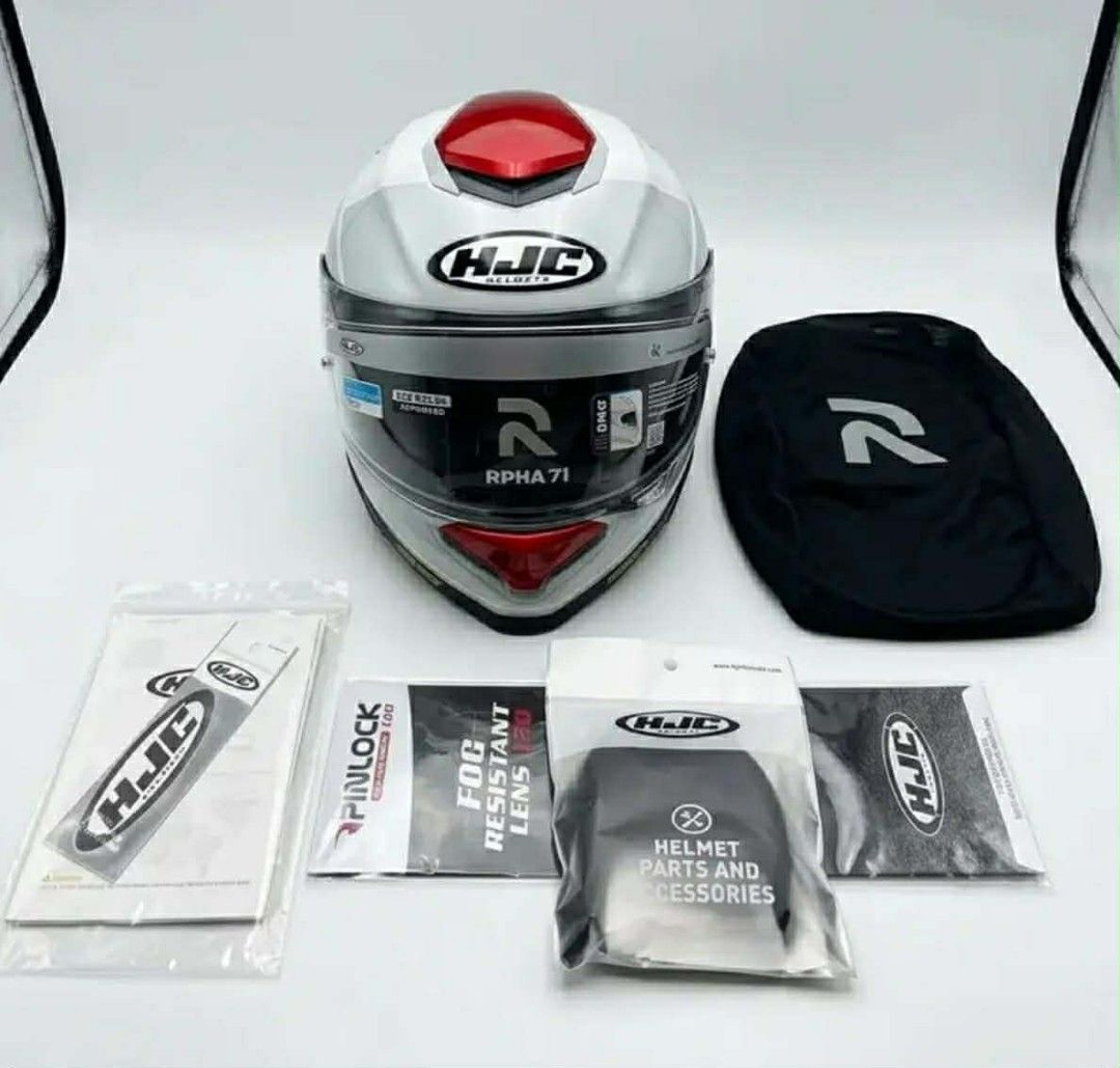 HJC RPHA 71 Motorcycle Helmet with Accessories (Category: Helmets and other Riding Gears) located in Manila. Submitted by quick.jerieme (Listing ID 1440634045, Image 2). Description: - HJC RPHA 71 Helmet - Color: White with red accents and RPHA branding - Includes: Helmet bag, Pinlock visor insert, and other HJC accessories - Ideal for motorcycle riders.