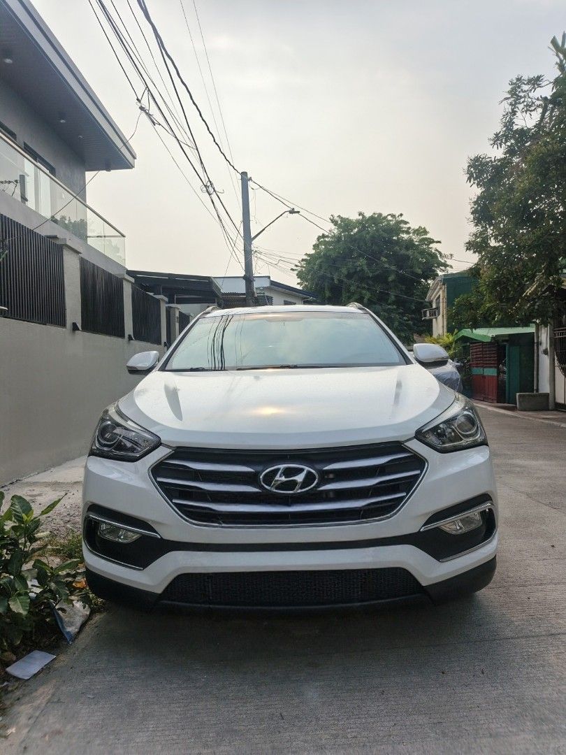 Hyundai Santa Fe GLS 2.2 CRDi Auto (Category: Used Cars) located in Quezon City. Submitted by btz753 (Listing ID 1440652745, Image 1). Description: WHITE PEARL; Well-maintained, major parts recently replaced. 🔧 Recent: Original brake pads/shocks/filters, fan belt, NWB wipers, resurfaced rotors, synthetic Dexron VI ATF, coolant & Wurth undercoat. ❄️ Aircon: Doowon compressor, new condenser, front/rear evaporators & expansion valve. 🛞 TOYO Proxes
