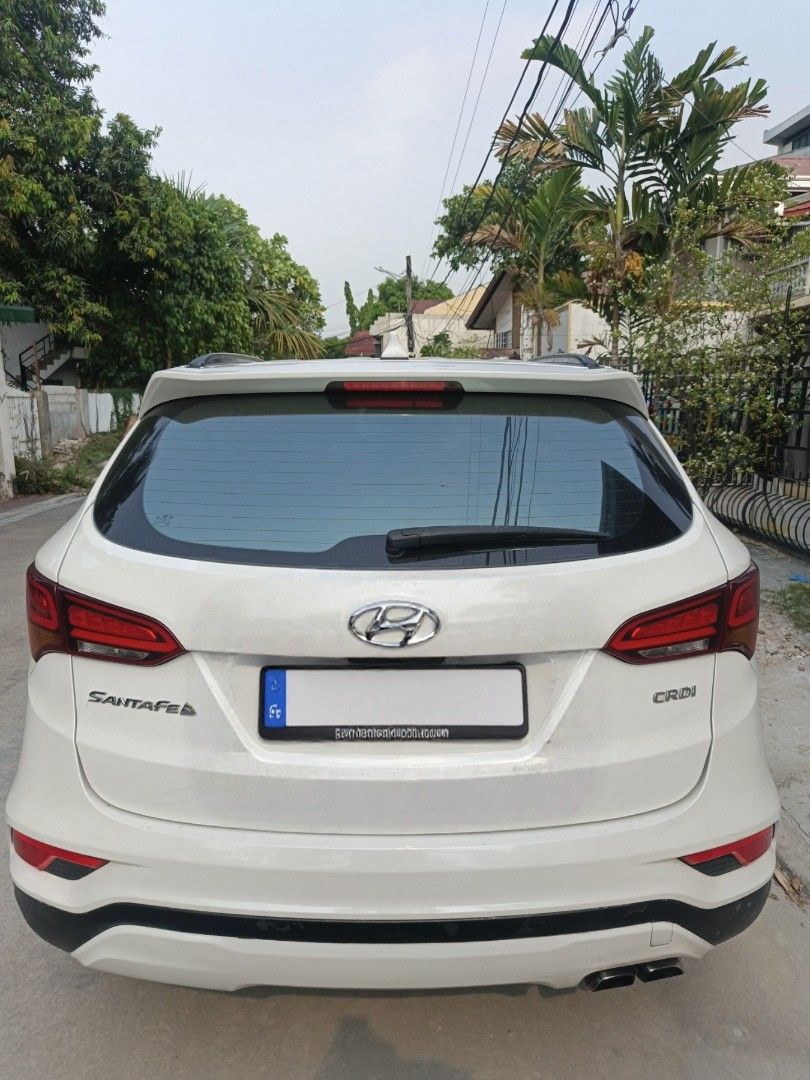 Hyundai Santa Fe GLS 2.2 CRDi Auto (Category: Used Cars) located in Quezon City. Submitted by btz753 (Listing ID 1440652745, Image 2). Description: WHITE PEARL; Well-maintained, major parts recently replaced. 🔧 Recent: Original brake pads/shocks/filters, fan belt, NWB wipers, resurfaced rotors, synthetic Dexron VI ATF, coolant & Wurth undercoat. ❄️ Aircon: Doowon compressor, new condenser, front/rear evaporators & expansion valve. 🛞 TOYO Proxes