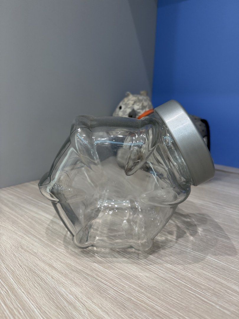 IKEA classic Candy Glass Jars with Lids (Category: Food Organisation & Storage) located in Singapore. Submitted by chaaiirroo (Listing ID 1440656787, Image 2). Description: - Set of 13 glass jars - 1for $5 Buy 12 get 1 FREE! - Unique hexagonal shape - Includes silver screw-on lids - Ideal for storing snacks, spices, or craft supplies - Clean and ready for use.