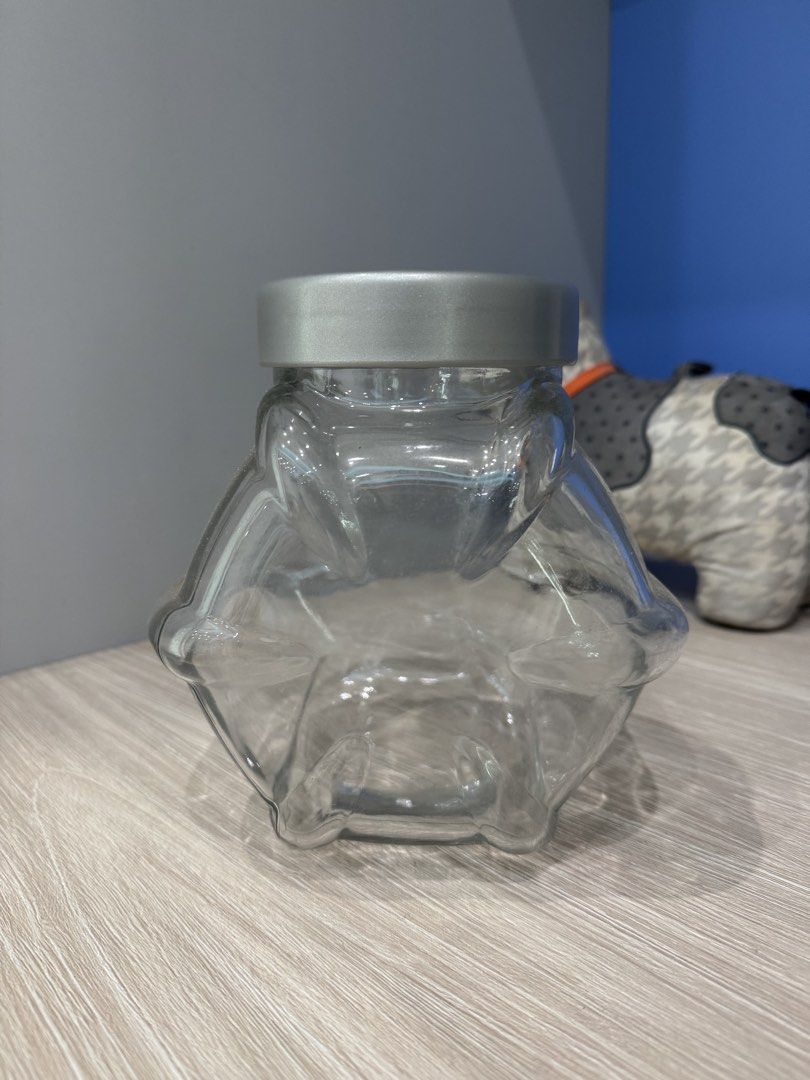 IKEA classic Candy Glass Jars with Lids (Category: Food Organisation & Storage) located in Singapore. Submitted by chaaiirroo (Listing ID 1440656787, Image 1). Description: - Set of 13 glass jars - 1for $5 Buy 12 get 1 FREE! - Unique hexagonal shape - Includes silver screw-on lids - Ideal for storing snacks, spices, or craft supplies - Clean and ready for use.