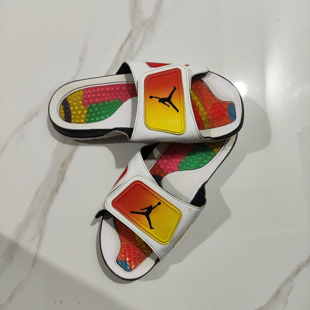 Jordan Slides White Red Yellow Black (Category: Slippers & Slides) located in Paranaque City. Submitted by jordangot (Listing ID 1440713169, Image 2). Description: - Jordan Slides in White - Red, Yellow, and Black accents - Colorful, textured footbed - Jumpman logo on strap - Size US 11 - Soles show some wear but have plenty of grip remaining.