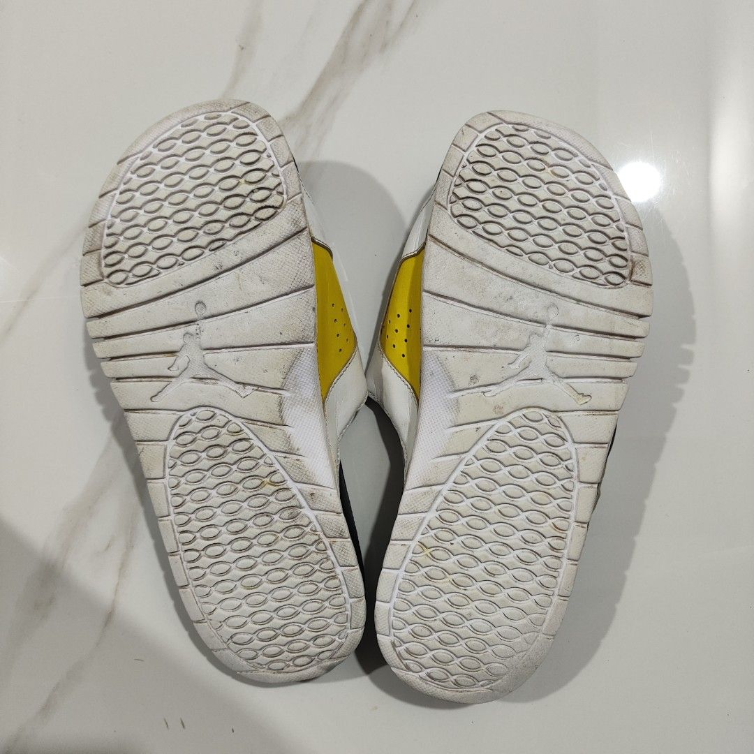 Jordan Slides White Red Yellow Black (Category: Slippers & Slides) located in Paranaque City. Submitted by jordangot (Listing ID 1440713169, Image 3). Description: - Jordan Slides in White - Red, Yellow, and Black accents - Colorful, textured footbed - Jumpman logo on strap - Size US 11 - Soles show some wear but have plenty of grip remaining.