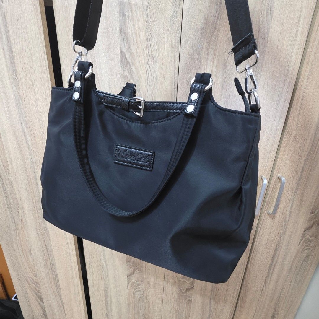 Kimbel Shoulder bag (Category: Shoulder Bags) located in Manila. Submitted by jms_shopping (Listing ID 1440715560, Image 3). Description: - Stylish black nylon shoulder bag - Multiple interior zippered compartments for organization - Includes a detachable shoulder strap - Ideal for everyday use - Spacious enough for all your essentials.