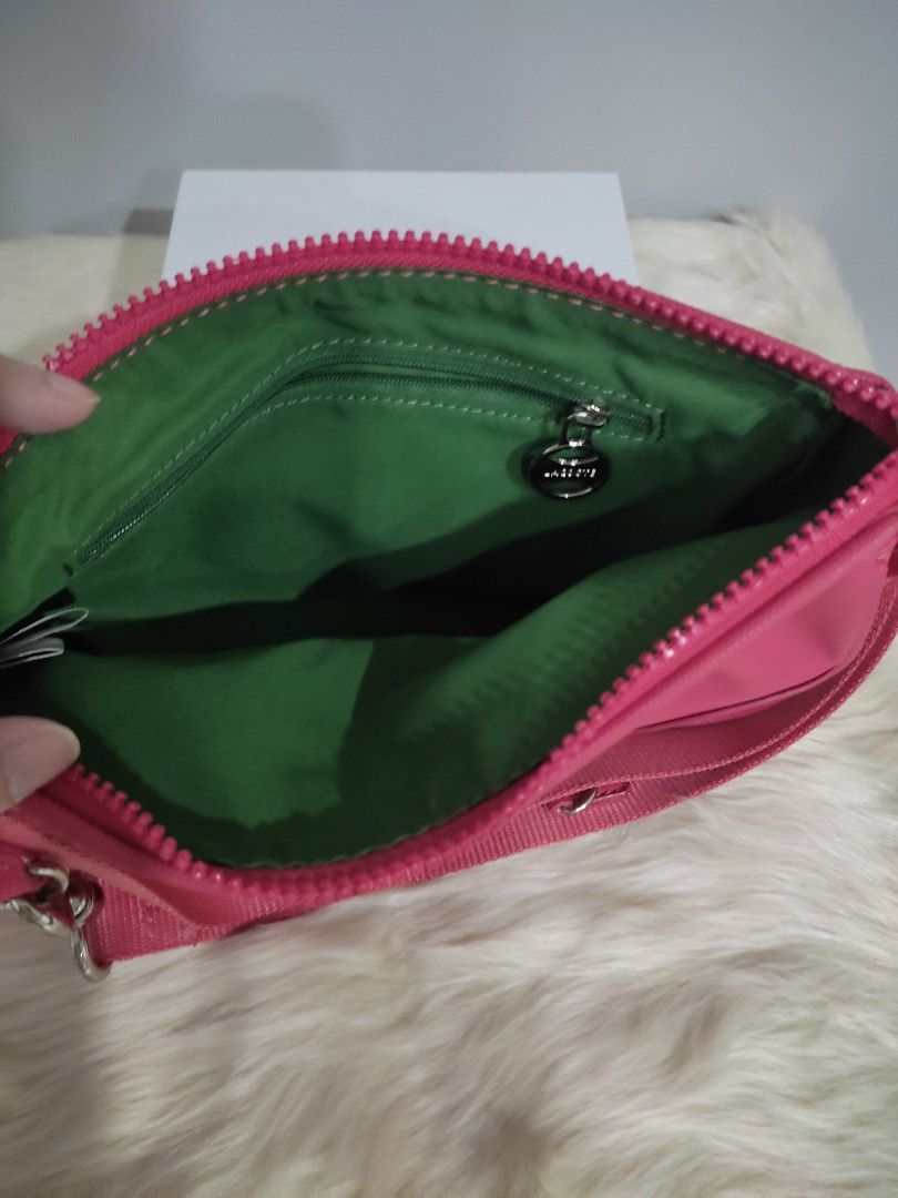 Lacoste Pink Nylon Crossbody Bag (Category: Cross-body Bags) located in Subic. Submitted by mirabrie (Listing ID 1440737975, Image 3). Description: - Cute pink Lacoste bag - Made of durable nylon material - Main zippered compartment - Inner pocket for organization - Adjustable strap for comfortable wear - Small and compact design - Ideal for everyday use or travel.