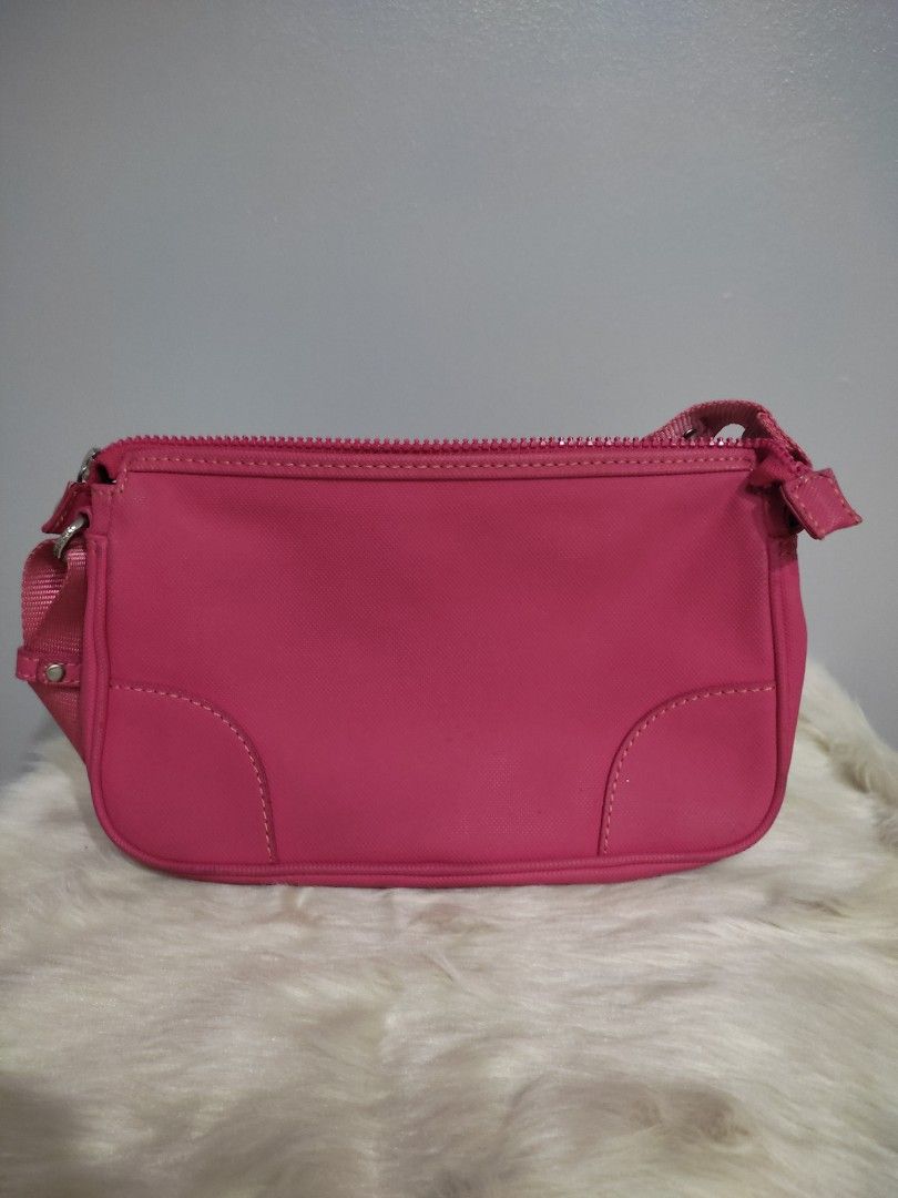 Lacoste Pink Nylon Crossbody Bag (Category: Cross-body Bags) located in Subic. Submitted by mirabrie (Listing ID 1440737975, Image 2). Description: - Cute pink Lacoste bag - Made of durable nylon material - Main zippered compartment - Inner pocket for organization - Adjustable strap for comfortable wear - Small and compact design - Ideal for everyday use or travel.