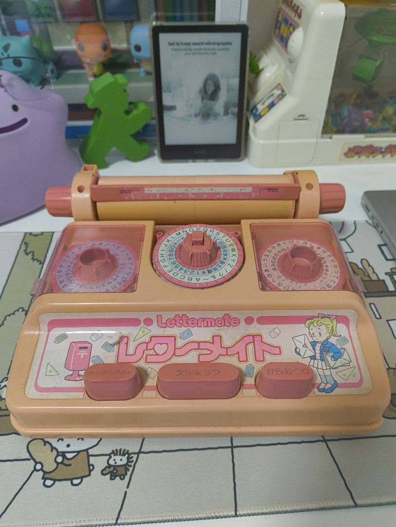 Lettermate Label Maker Pink Vintage Japanese Retro (Category: Coffee Machines & Makers) located in Caloocan City. Submitted by cowrator (Listing ID 1440729321, Image 2). Description: Vintage Japanese letter-making toy with a working mechanism. Shows age-related discoloration, scratches, scuffs, and small chips. Not in perfect condition, but still a great collectible or display piece. Condition: Working mechanism. Cosmetic wear consistent with age