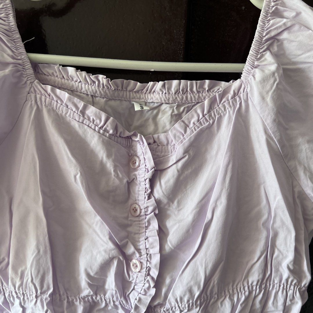 Lilac Puff Sleeve Square Neck Button Up Crop Top (Category: Blouses) located in Quezon City. Submitted by kattykatt (Listing ID 1440580560, Image 2). Description: - Adorable lilac crop top - Chic square neckline with ruffled trim - Sweet short puff sleeves - Functional buttons down the front - Comfortable elasticated hem - Versatile for casual outings or dressing up.