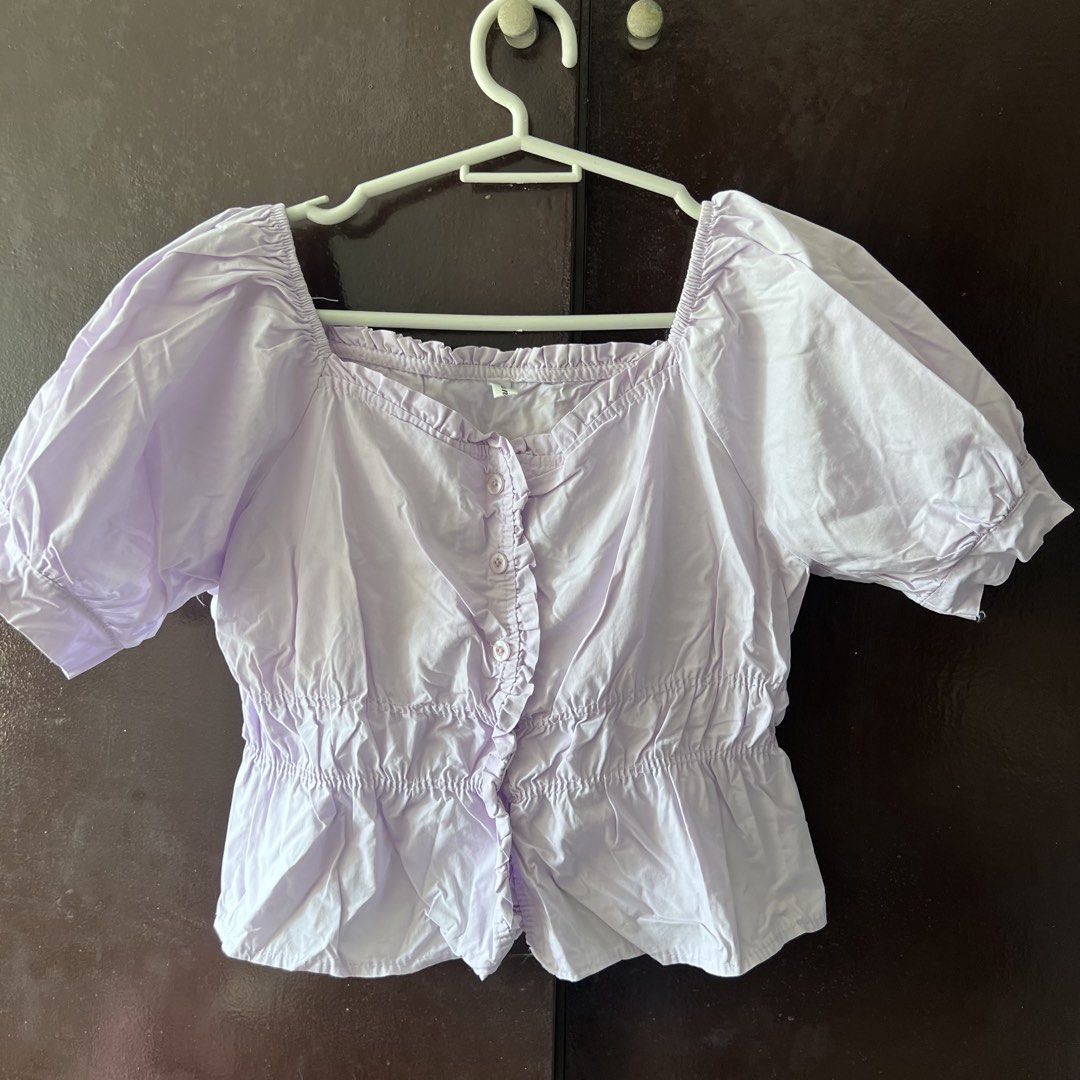 Lilac Puff Sleeve Square Neck Button Up Crop Top (Category: Blouses) located in Quezon City. Submitted by kattykatt (Listing ID 1440580560, Image 1). Description: - Adorable lilac crop top - Chic square neckline with ruffled trim - Sweet short puff sleeves - Functional buttons down the front - Comfortable elasticated hem - Versatile for casual outings or dressing up.