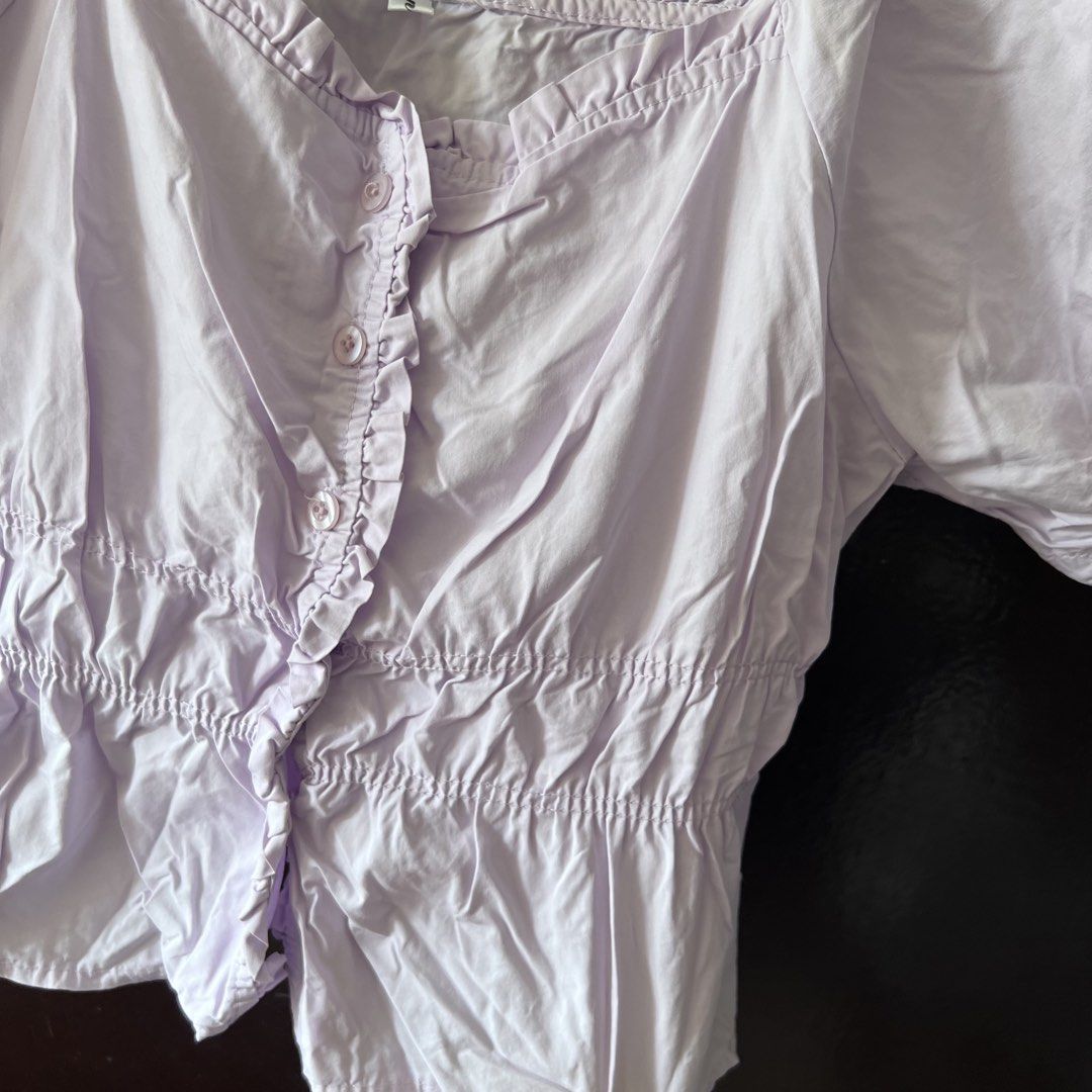 Lilac Puff Sleeve Square Neck Button Up Crop Top (Category: Blouses) located in Quezon City. Submitted by kattykatt (Listing ID 1440580560, Image 3). Description: - Adorable lilac crop top - Chic square neckline with ruffled trim - Sweet short puff sleeves - Functional buttons down the front - Comfortable elasticated hem - Versatile for casual outings or dressing up.