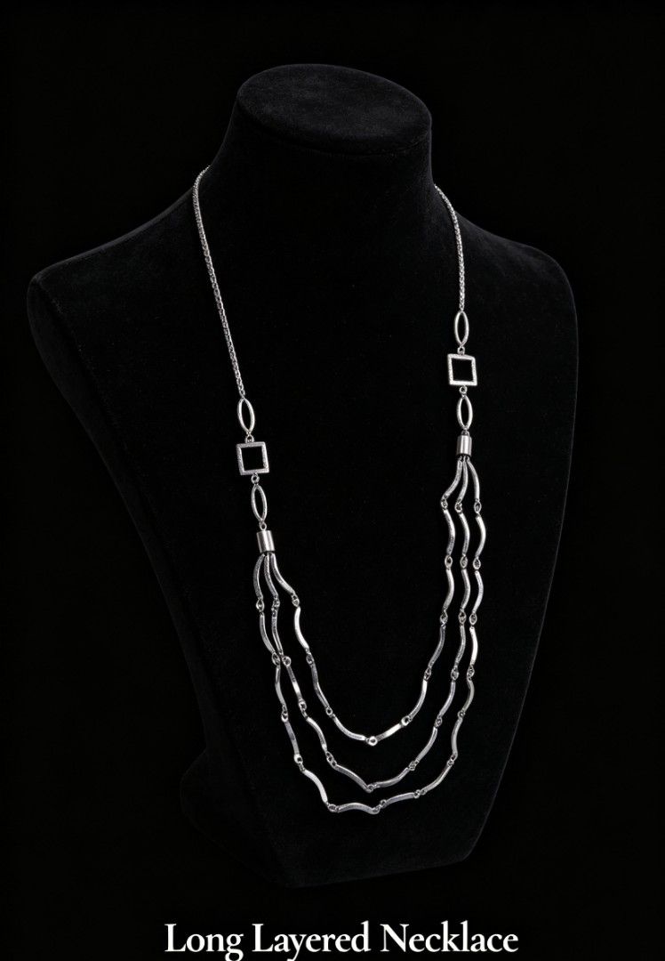 Long Layered Necklace (Category: Necklaces) located in Davao. Submitted by wengbagstuff (Listing ID 1440746288, Image 1). Description: - Silver-tone finish - Long, layered necklace design - Features a mix of oval and square chain links - Wavy bar details on the layered section - Statement piece to add interest to any outfit - Ideal for dressing up basic tops.